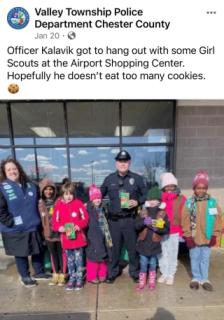 Officer Kalavik helping out our local Girl Scout Troops with their cookies! (YUM)